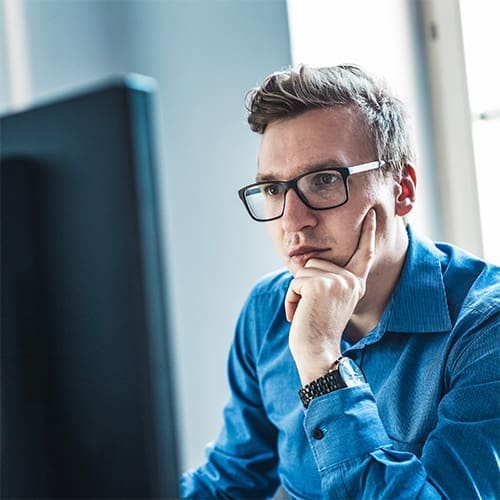 man concentrating on computer